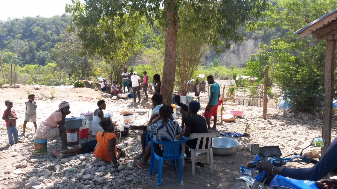 Waiting in the Shade at Tete-a-l'eau Refugee Camp