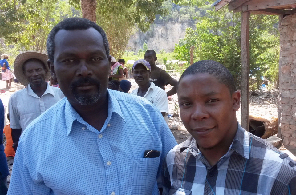 Community leader Yvon Jean-Boni (on left) & Heart to Heart's Dr. Jackenson Davilmar at Tete-a-l'Eau Refugee Camp